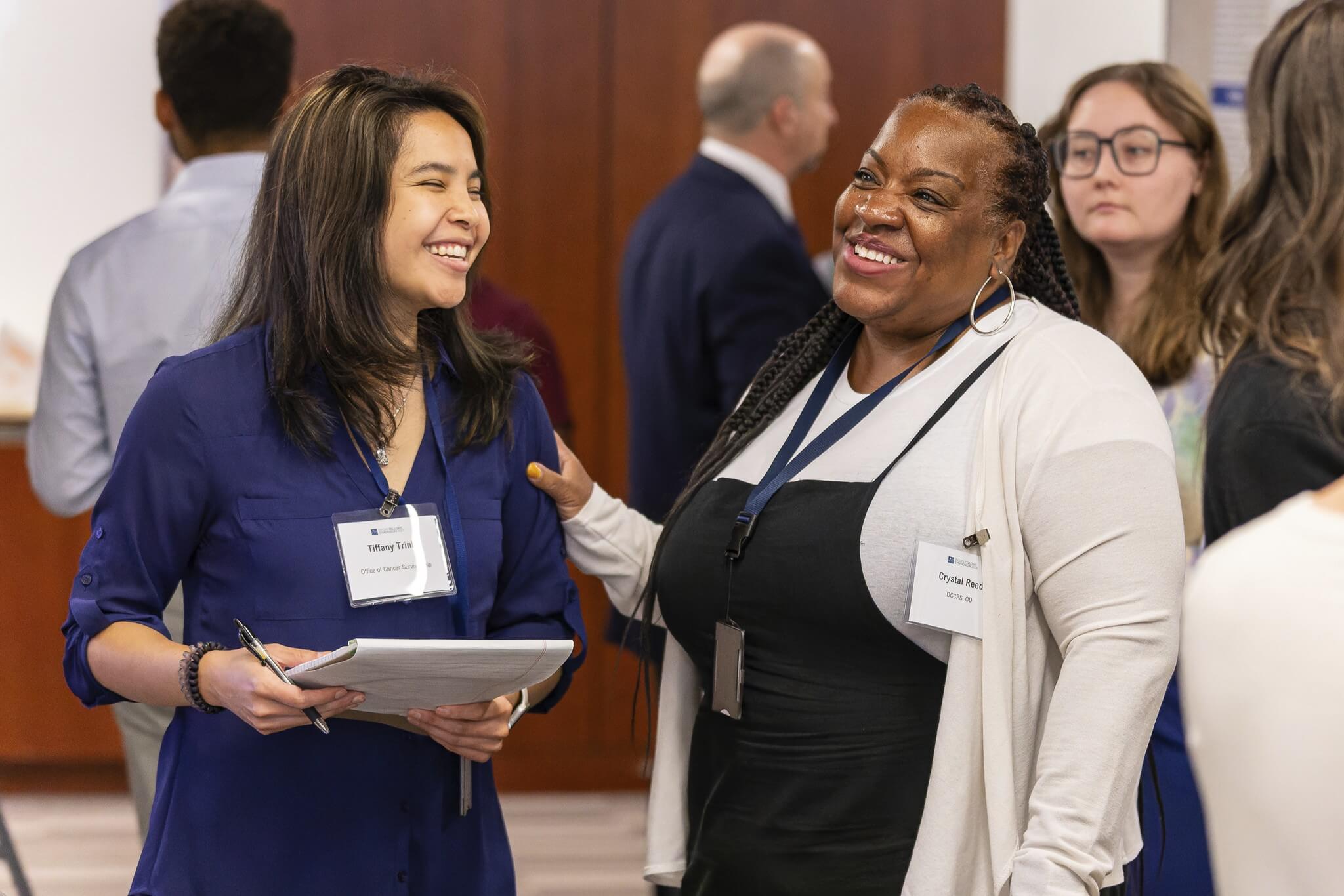 Women talking at a conference